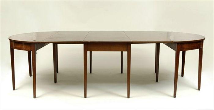 Appraisal: George III-Style Mahogany Three-Part Dining Table Comprising a drop-leaf center