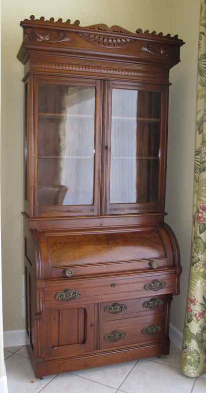 Appraisal: VICTORIAN CYLINDER ROLL TOP SECRETARY Carved crest with applied decoration