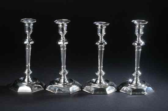 Appraisal: FOUR ELIZABETH II SILVER CANDLESTICKS Sterling and lion passant marks