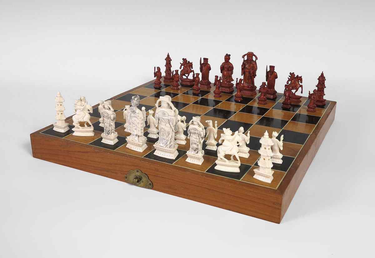 Appraisal: CARVED IVORY CHESS SET Complete set of pieces kings measure