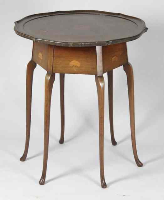 Appraisal: An Edwardian occasional table circa with shaped inlaid circular top