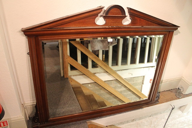 Appraisal: AN EDWARDIAN MAHOGANY OVERMANTEL MIRROR with architectural cornice and bevel