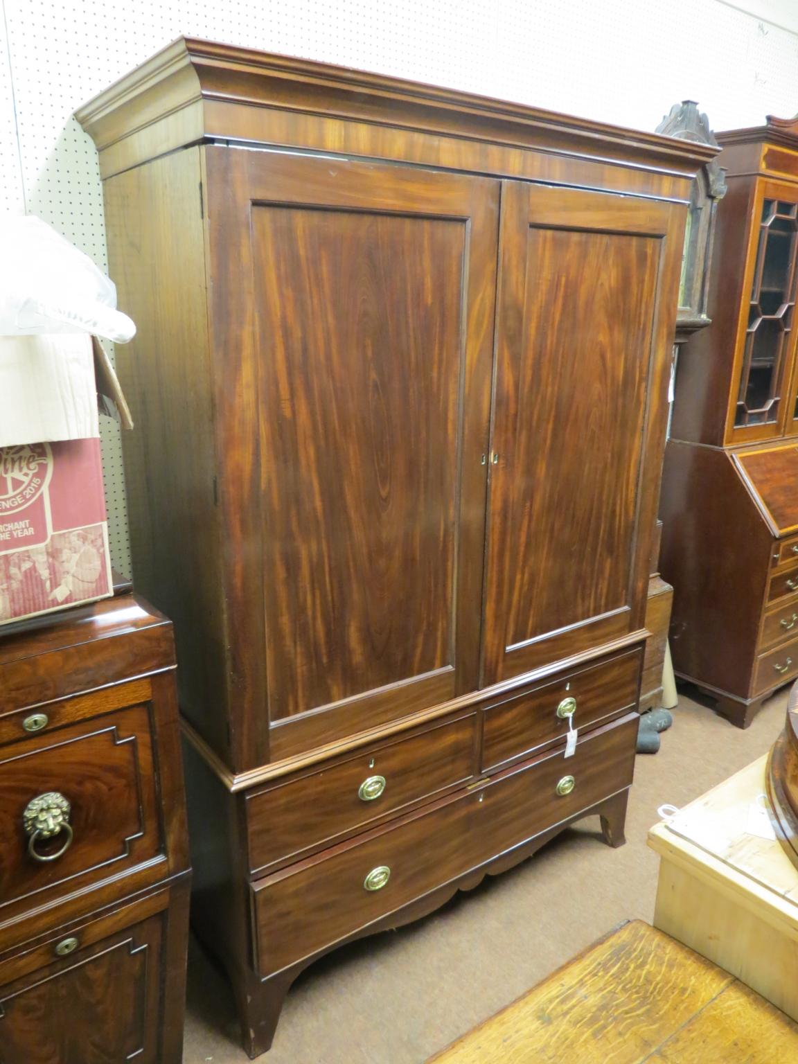 Appraisal: A mid-Victorian mahogany wardrobe pair of panelled doors enclosing space