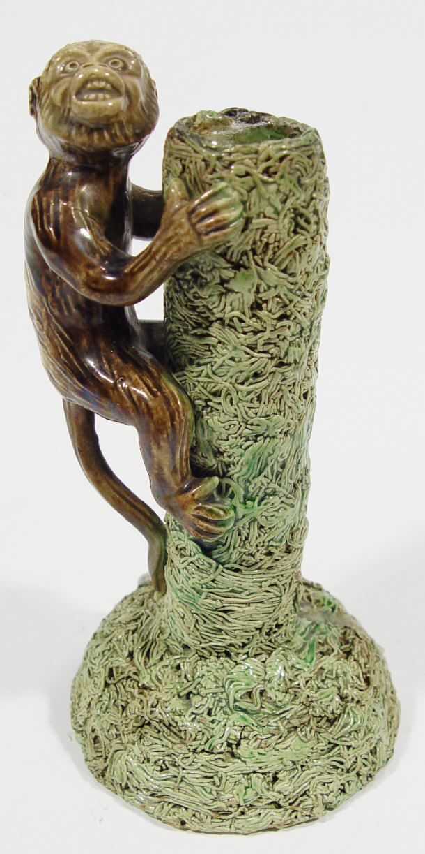 Appraisal: Palissy Majolica spill vase modelled with a monkey climbing a