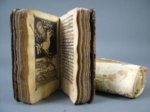 Appraisal: A leather bound hand scrivened religious text illustrated with miniatures