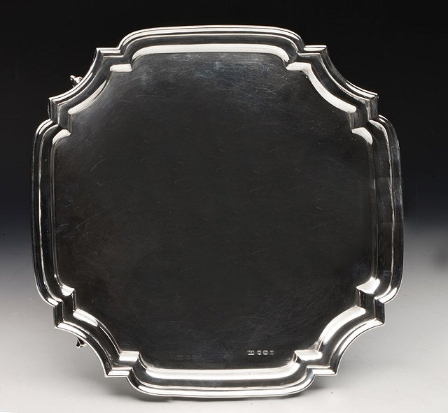 Appraisal: A SILVER SALVER of square cut canted form with raised