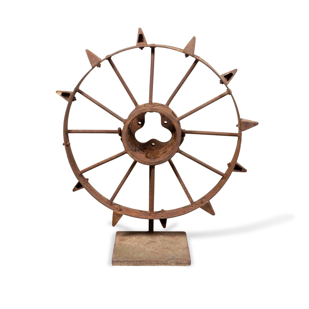 Appraisal: AMERICAN FOLK ART IRON WHEEL SCULPTURE ON STAND American School