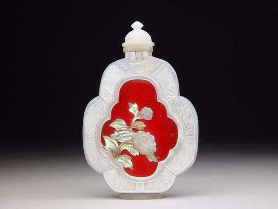 Appraisal: MOTHER-OF-PEARL SNUFF BOTTLE Ornate sectional mother-of-pearl snuff bottle of flattened