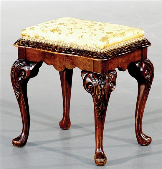 Appraisal: English carved walnut footstool late th century padded cushion in