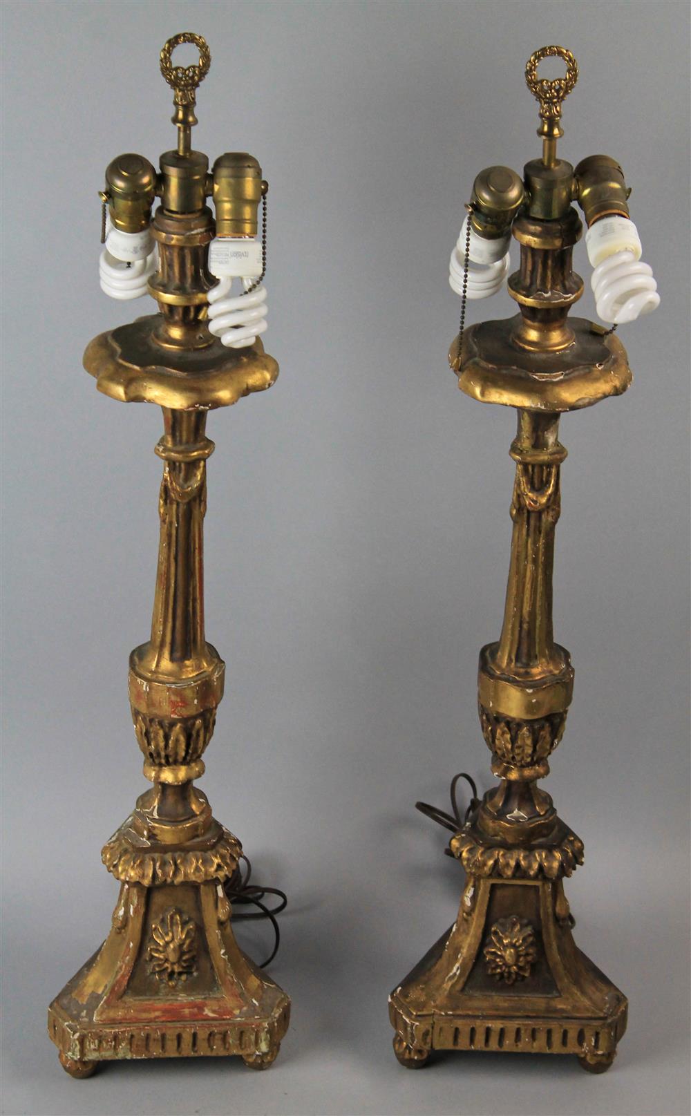 Appraisal: PAIR OF NEOCLASSIC STYLE GILTWOOD PRICKET STICK LAMPS with swag