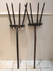 Appraisal: Two continental four tine hay forks of rustic manufacture and