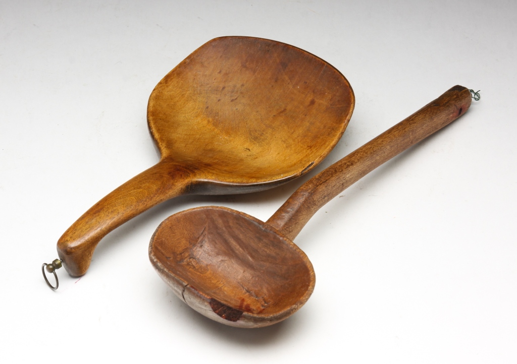 Appraisal: TWO AMERICAN WOODEN UTENSILS Mid th century maple Long handled