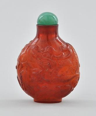 Appraisal: A Carved Amber Glass Snuff Bottle Rounded shape glass bottle