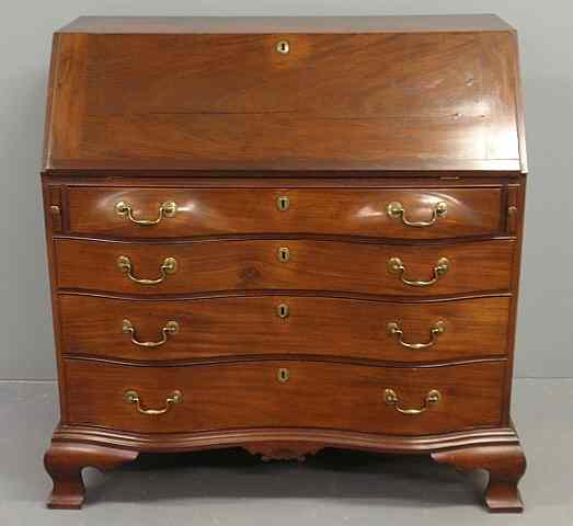 Appraisal: New England Chippendale mahogany oxbow slant-lid desk c with a