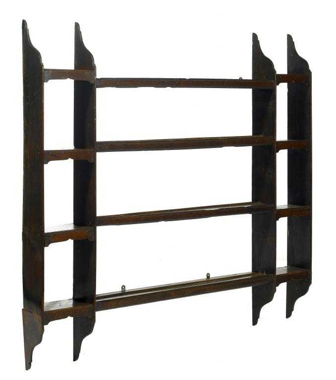 Appraisal: A GEORGE III OAK PLATE RACK with four shaped uprights