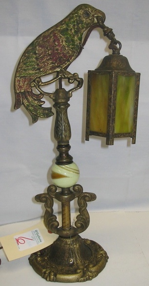 Appraisal: A PAINTED FIGURAL PARROT DESK LAMP the six-sided slag glass