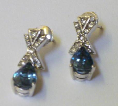 Appraisal: A PAIR OF BLUE TOPAZ AND DIAMOND EARRINGS having diamond