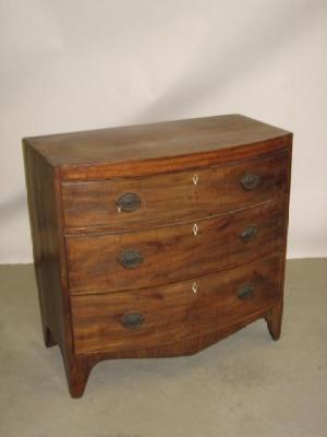 Appraisal: A GEORGE III MAHOGANY CHEST of bowed form with ebony