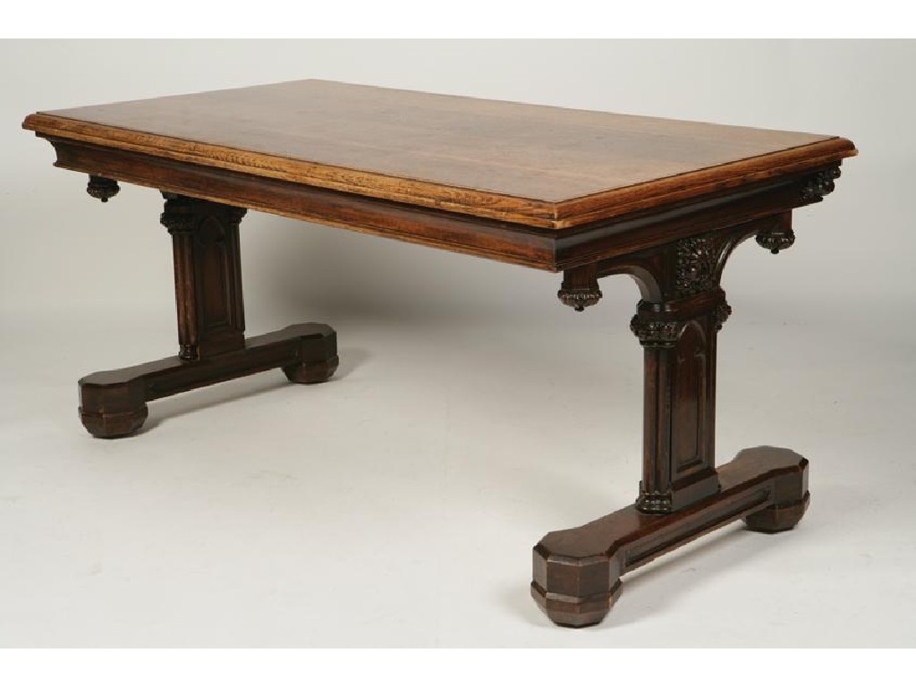 Appraisal: A VICTORIAN OAK GOTHIC REVIVAL LIBRARY TABLE the rectangular top