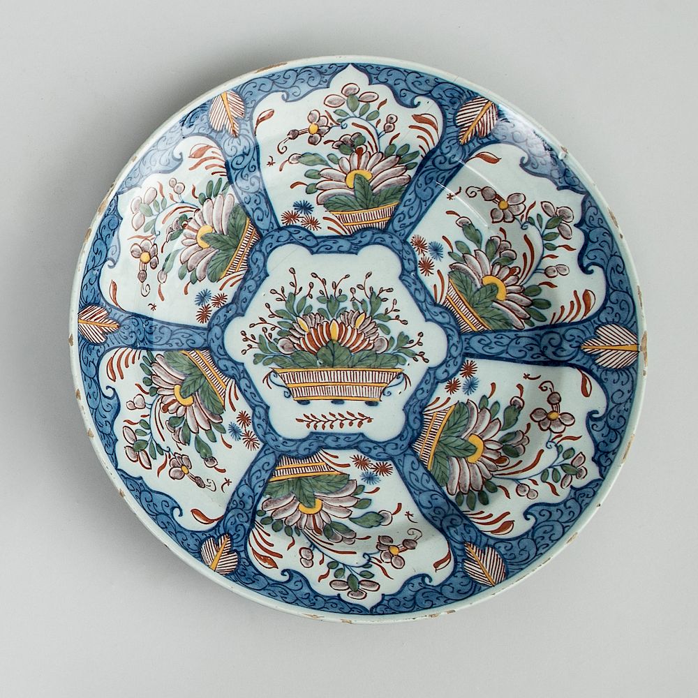 Appraisal: Dutch Polychrome Delft Charger With underglaze blue step and line