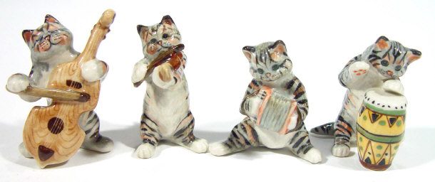 Appraisal: Hand painted Beswick style four piece pottery cat musical band