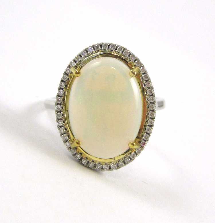 Appraisal: OPAL DIAMOND AND FOURTEEN KARAT GOLD RING The white gold