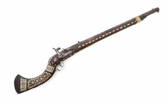 Appraisal: A Middle Eastern Bone Inlaid Percussion Cap Rifle having geometric