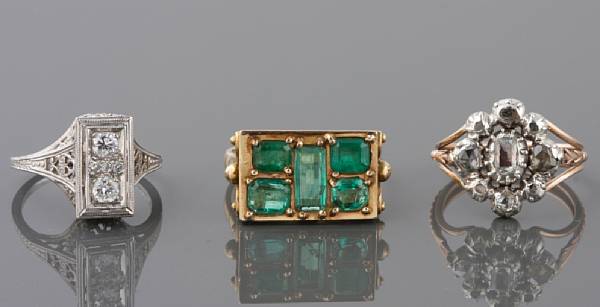 Appraisal: A collection of three diamond emerald white and yellow gold