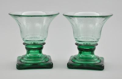 Appraisal: A Pair of Green Glass Vases Footed urn shape green