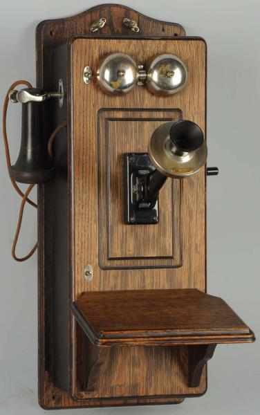 Appraisal: Western Electric CTPFF Wall Telephone Circa oak red A magneto