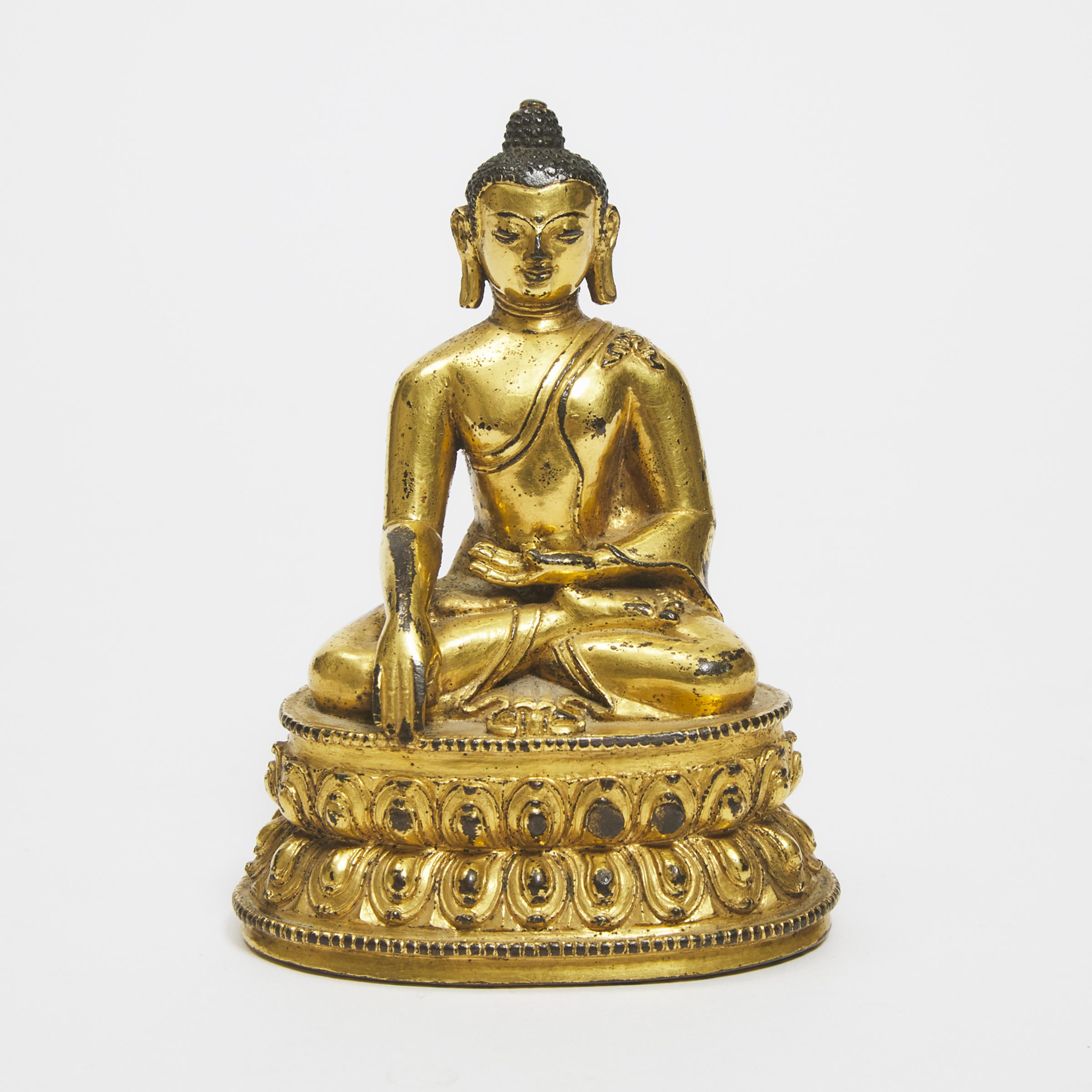 Appraisal: A Gilt Copper Alloy Figure of Seated Shakyamuni Buddha Tibet