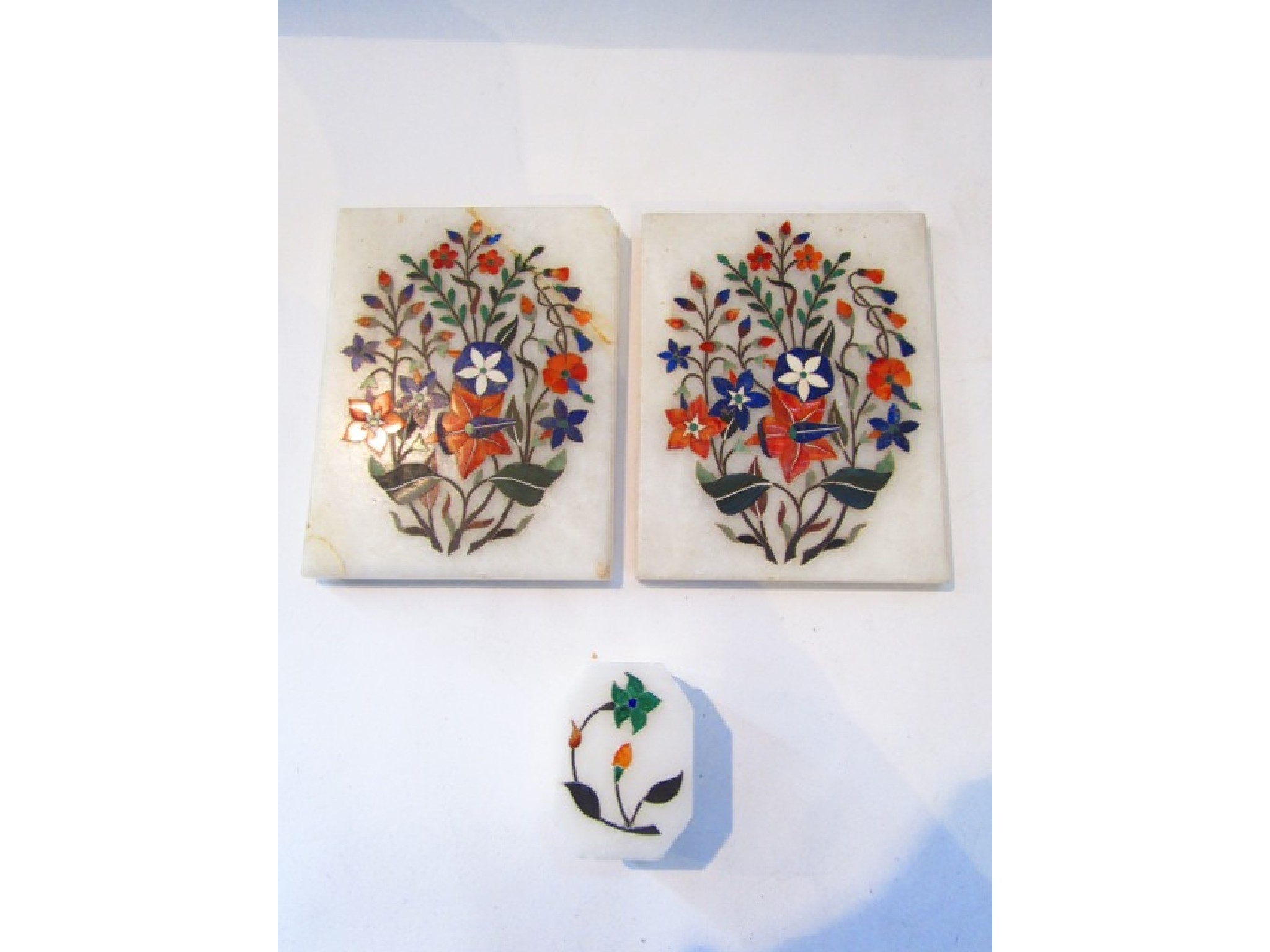 Appraisal: Two marble panels inlaid with multi coloured stone floral sprays