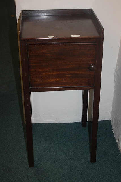 Appraisal: A GEORGE III MAHOGANY POT CUPBOARD with plain panelled door