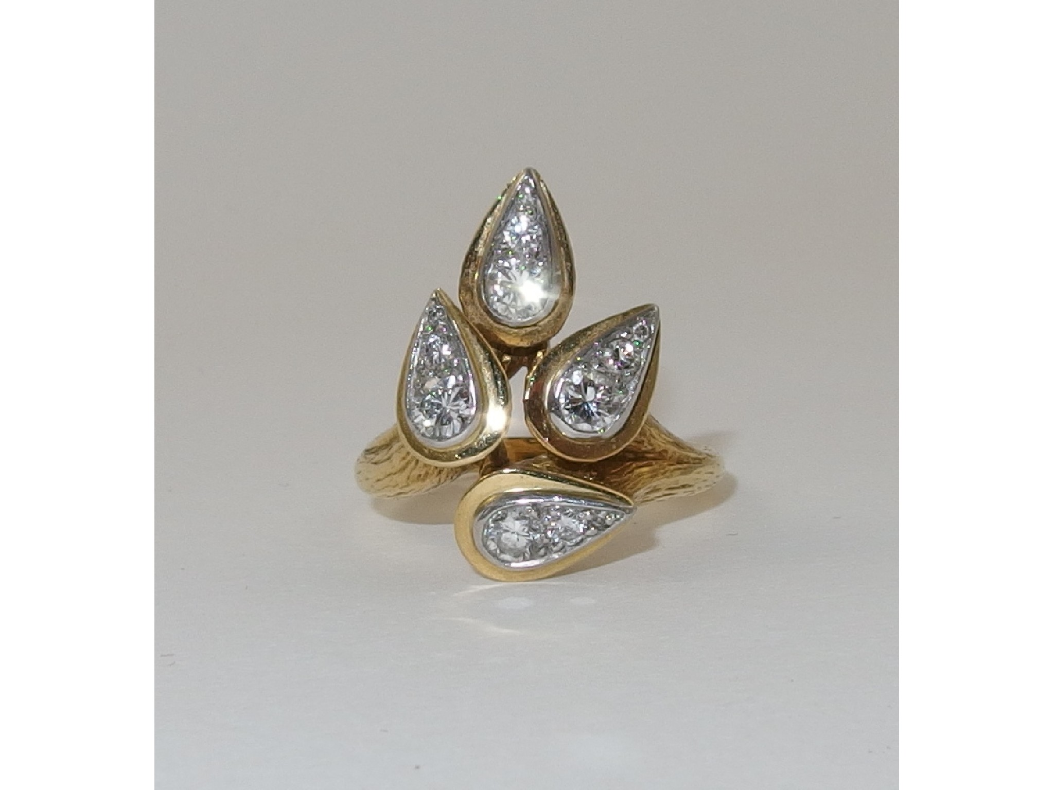 Appraisal: An ct diamond set leaf ringthe design of four organic