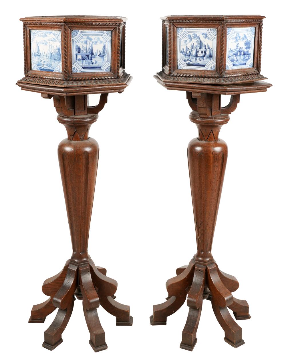 Appraisal: PAIR OF DELFT POTTERY-INSET OAK JARDINIERES ON STANDSeach hexagonal planter