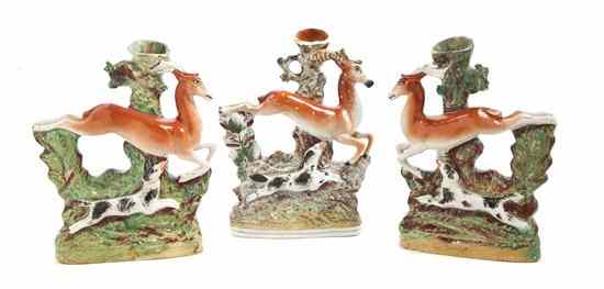 Appraisal: Three Staffordshire Figural Spill Vases each depicting a leaping deer