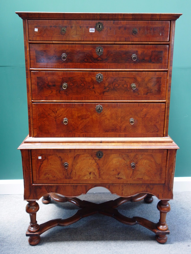 Appraisal: A William and Mary figured walnut chest on stand the