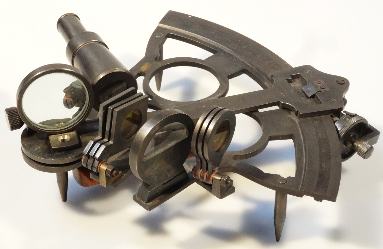 Appraisal: A thC metal sextant with articulated wooden handle and centre