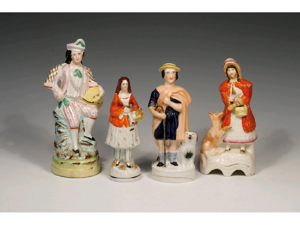 Appraisal: A STAFFORDSHIRE POTTERY GROUP OF A SHEPHERD holding a staff