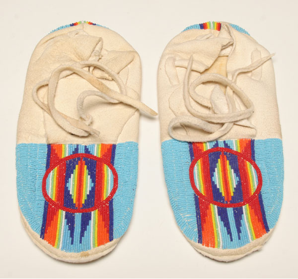 Appraisal: Native American moccasins laced buckskin with vibrant geometric beadwork L