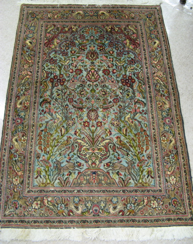 Appraisal: PERSIAN QUM PRAYER RUG hand knotted in a vase of