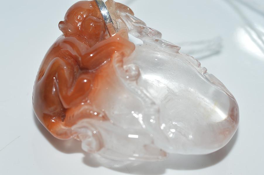 Appraisal: A CARVED ROCK CRYSTAL AGATE PENDANT DEPICTING A MONKEY A