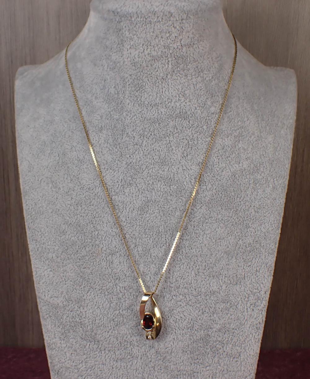 Appraisal: GARNET DIAMOND AND FOURTEEN KARAT GOLD PENDANT NECKLACE with a