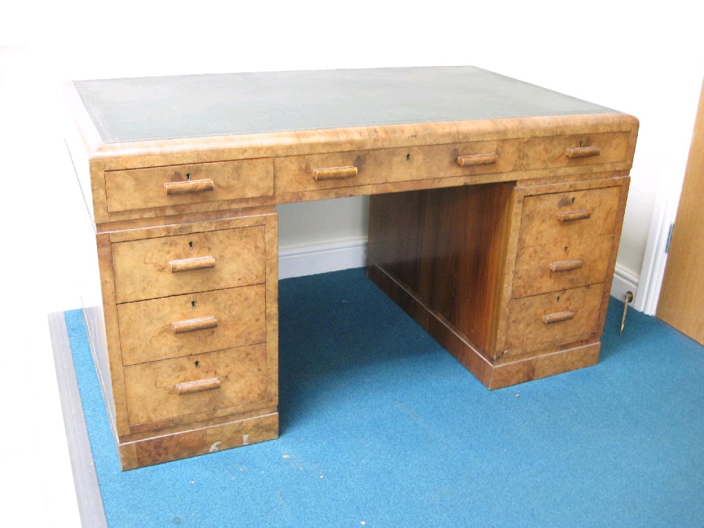 Appraisal: An Art Deco walnut pedestal Desk inset leather top above