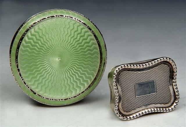 Appraisal: A SILVER AND ENAMELLED CIRCULAR COMPACT with engine turned decoration