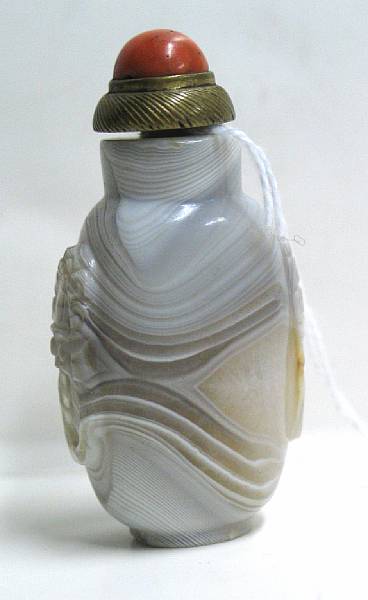 Appraisal: A banded agate snuff bottle The ovoid bottle with large