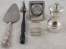 Appraisal: Silver A pepper mill a candle douter a bedside clock