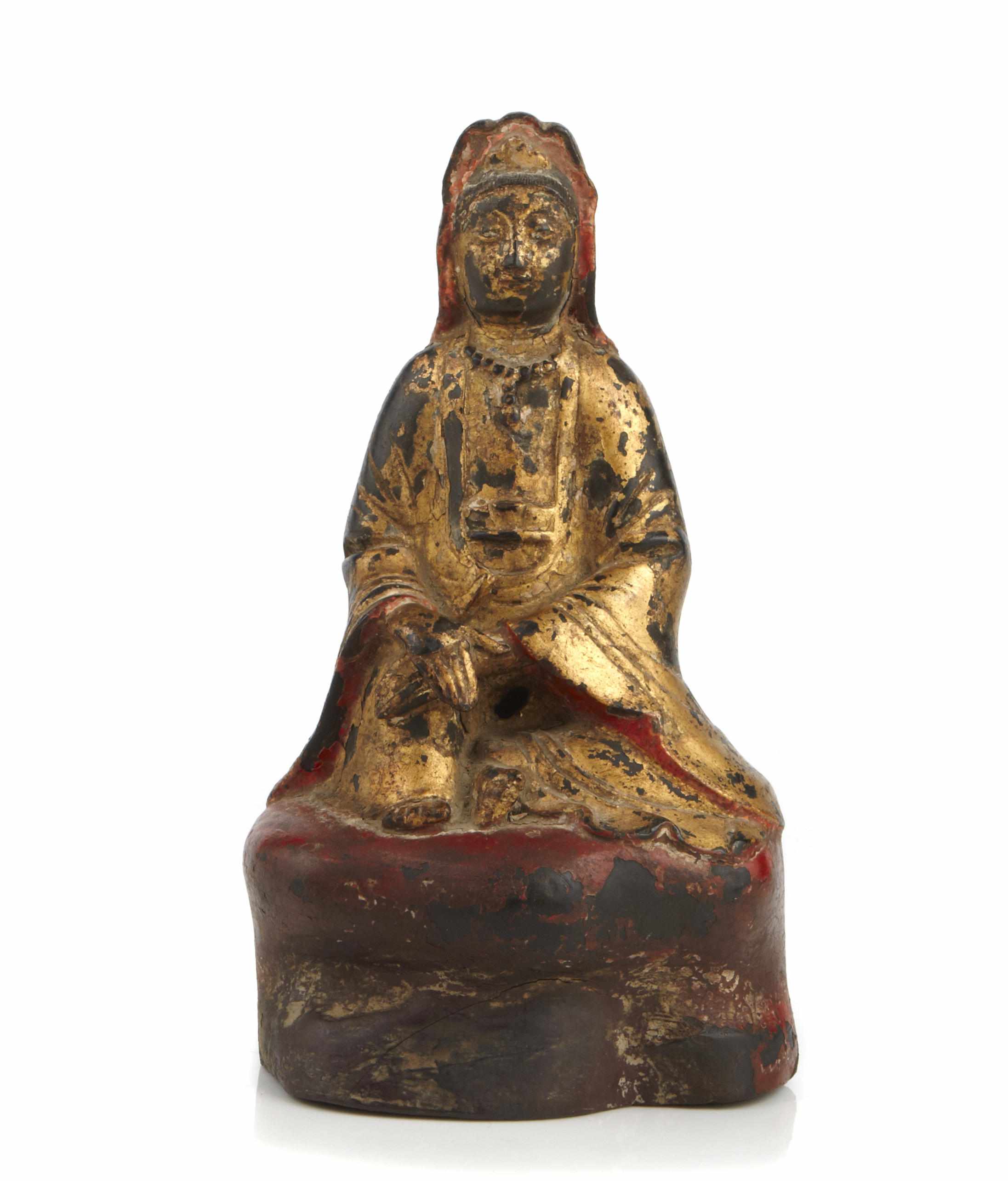 Appraisal: A paint decorated and gilt metal figure of a seated