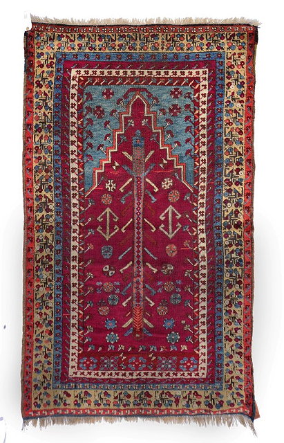 Appraisal: AN ANTIQUE ANATOLIAN PRAYER RUG with a central stylised hooked