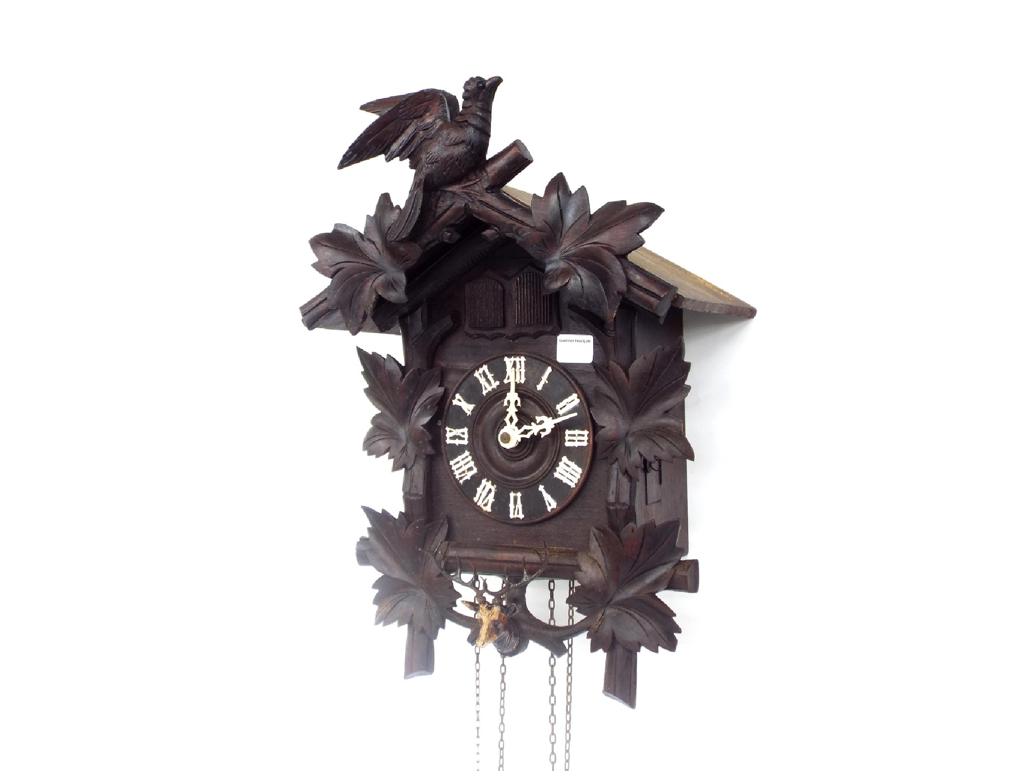 Appraisal: Black Forest cuckoo and quail wall clock the dial within